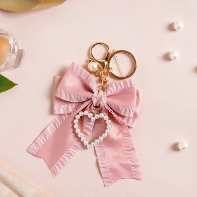 Bow with Pearl Heart Charm