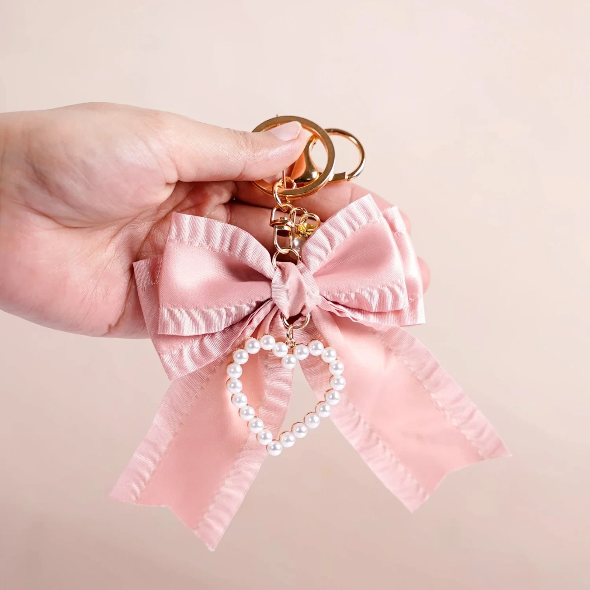 Bow with Pearl Heart Charm