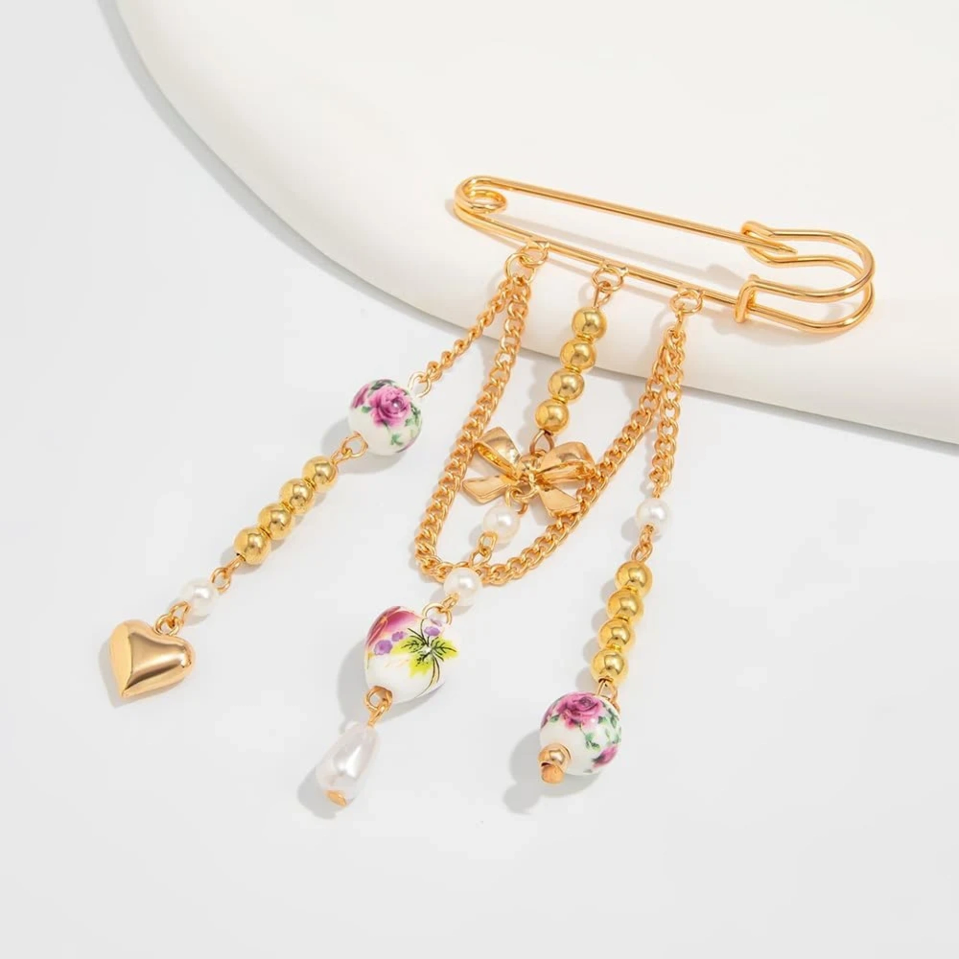 Floral bow tassel pin